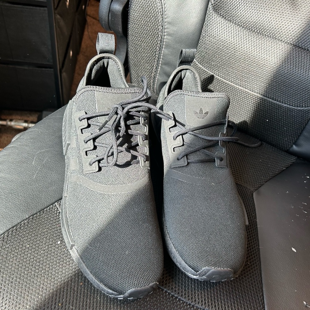 All black NMD’s adidas